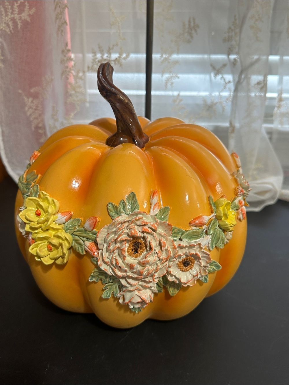 Fall harvest pumpkin with floral ceramic decor